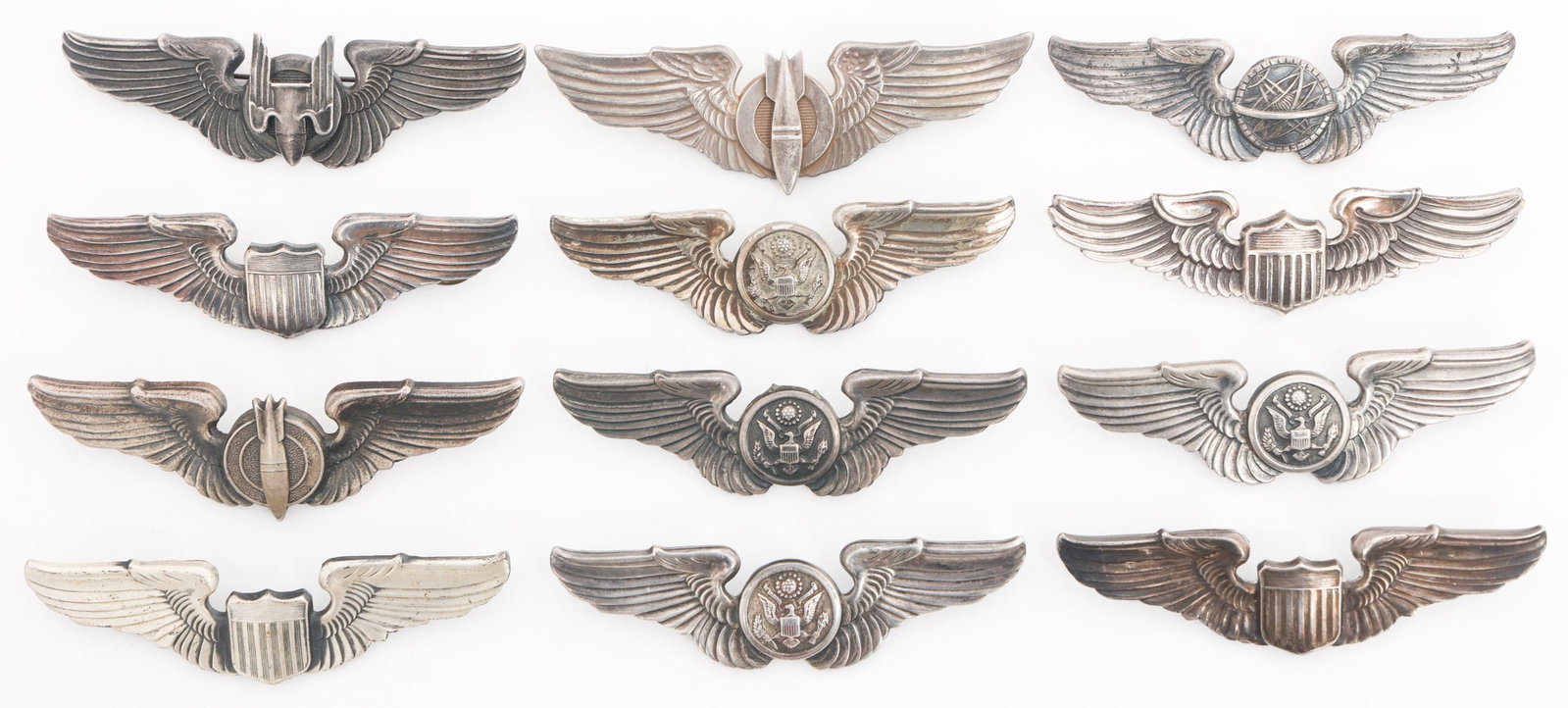 WWII USAAF STERLING PILOT, GUNNER, NAVIGATOR WINGS: WWII USAAF STERLING PILOT, GUNNER, NAVIGATOR WINGS WWII US Army Air Force Sterling Pilot, Aerial Gunner, Bombardier, Navigator, and Air Crew 3" Wings. Makers marks include A.E. Co. All but two are mar