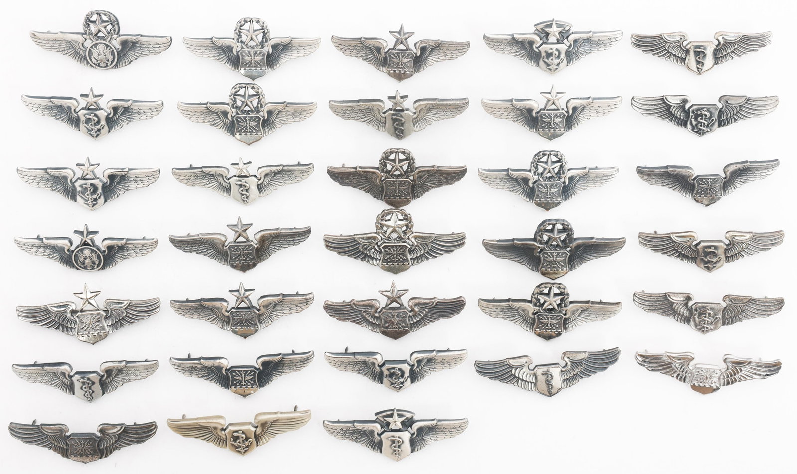 COLD WAR USAF FLIGHT SURGEON & AIR CREW WINGS: COLD WAR USAF FLIGHT SURGEON & AIR CREW WINGS Cold War US Air Force Flight Surgeon, Nurse, Navigator, and Air Crew Wings. Maker marks include N.S. Meyer, H.L.P., Krew, Simco, Vanguard, and Antaya.