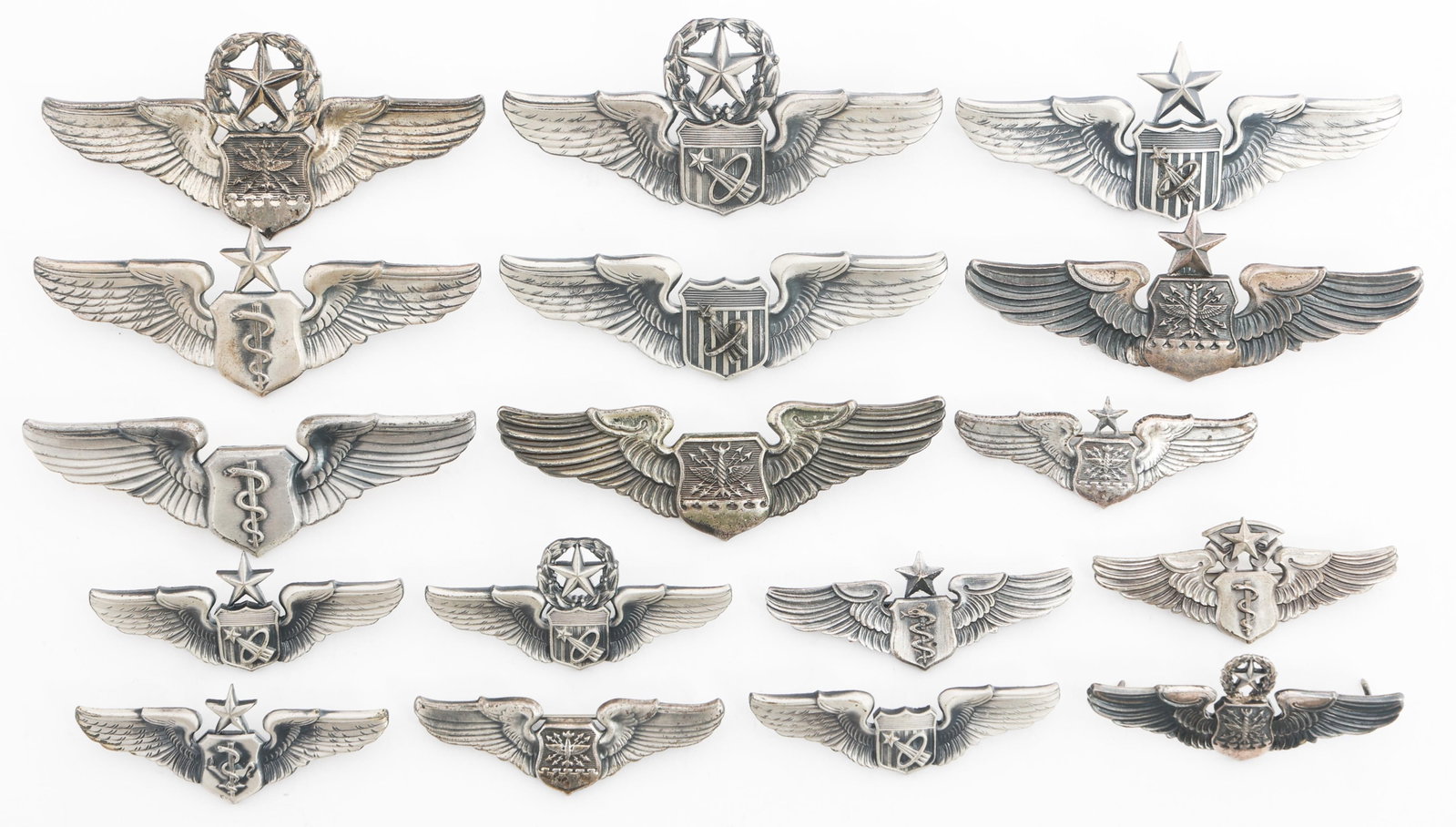 COLD WAR USAF STERLING ASTRONAUT & NAV. WINGS: COLD WAR USAF STERLING ASTRONAUT & NAV. WINGS Cold War US Air Force Flight Surgeon, Astronaut, and Navigator Sterling Wings. Maker marks include N.S. Meyer, Vanguard, Gemsco, and A.H. Dondero. Pin bac