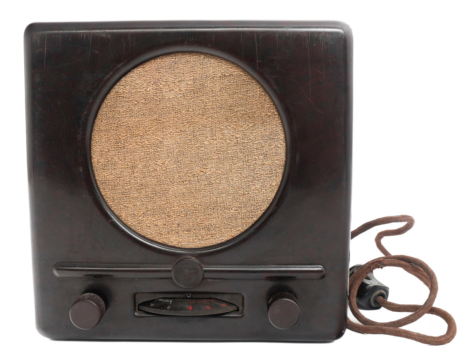 WWII GERMAN CIVILIAN RADIO by SACHSENWERK: WWII GERMAN CIVILIAN RADIO by SACHSENWERK WWII German Radio by Sachsenwerk. Bakelite housing. Maker marked and dated 1938 on the reverse. Power cord with plug. Size: 9 1/2" x 9 1/2" x 5"