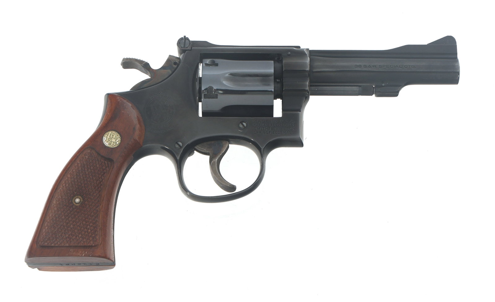 SMITH & WESSON MODEL 15-4 .38 SPL CALIBER REVOLVER: SMITH & WESSON MODEL 15-4 .38 SPL CALIBER REVOLVER Smith & Wesson Model 15-4 .38 SPL caliber double action revolver. Blued finish. Ramp front sight. Adjustable rear sight. Checkered wood grips with S&