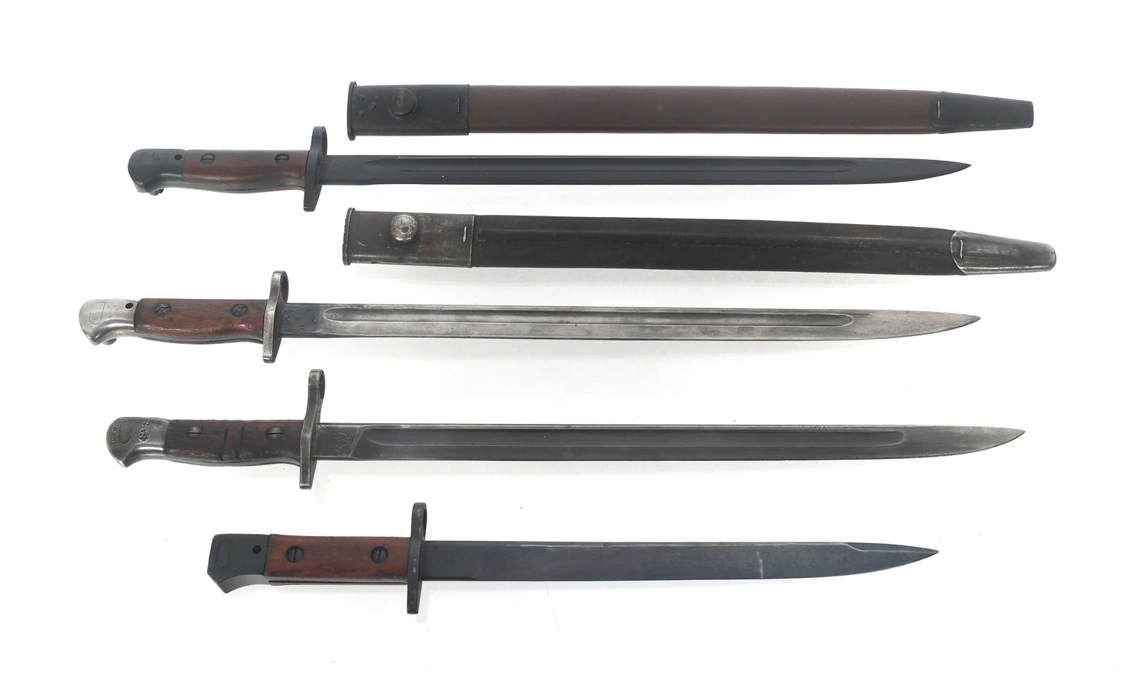 BRITISH BAYONETS: BRITISH BAYONETS Four British bayonets from WWI to Cold War. Two include scabbards. Blade Length: 12" - 17" Total Length: 16.5" - 22"