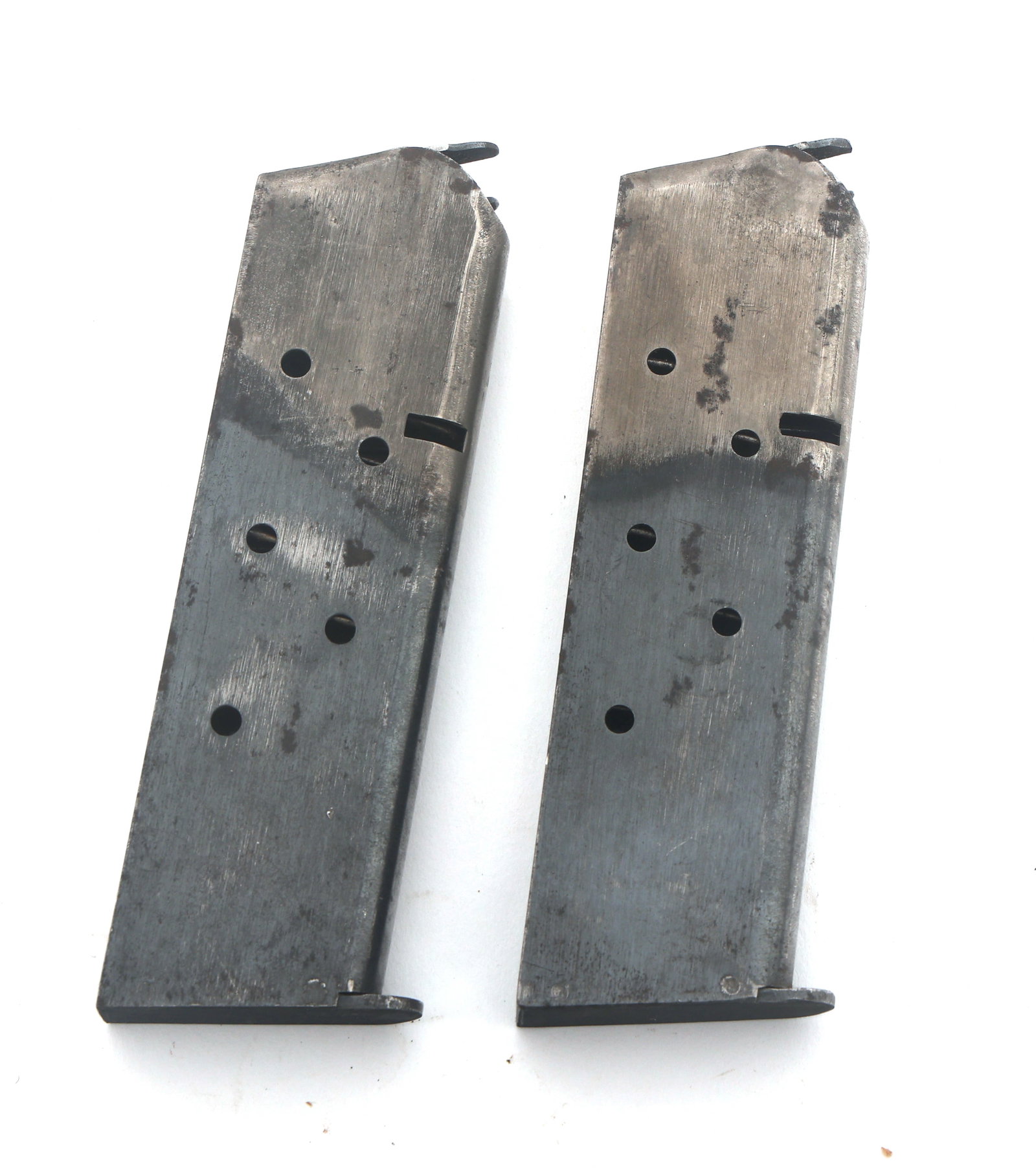 US 1911 TWO TONED PISTOL MAGAZINES: US 1911 TWO TONED PISTOL MAGAZINES Two US 1911 two toned pistol magazines. Toe is stamped with A and B. Size / Gauge: 45