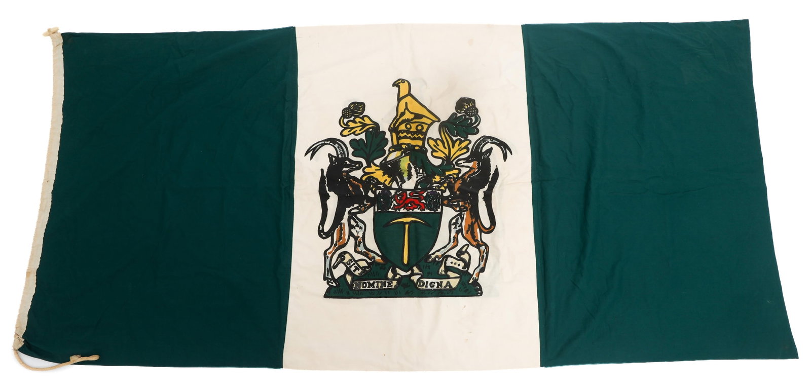 BUSH WAR RHODESIAN NATIONAL UDI FLAG: BUSH WAR RHODESIAN NATIONAL UDI FLAG Bush War Rhodesian National Independence Flag. Double sided, multi piece cotton with printed emblem. Draw rope and toggle. No visible maker marks. Size: 35" x 72"