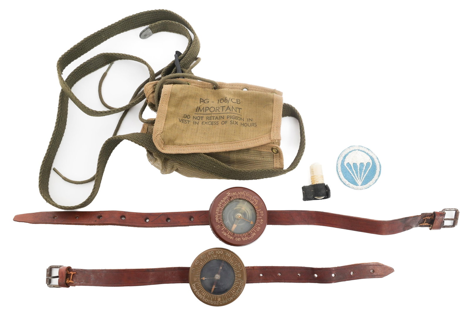 WWII US PARATROOPER COMPASSES & PIGEON CORPS GEAR: WWII US PARATROOPER COMPASSES & PIGEON CORPS GEAR WWII US Paratrooper Compasses and Pigeon Corps Field Gear. (1) PG-106/cb pigeon vest. OD canvas mesh with strings. (1) PG-67 message capsule. (1) Airb