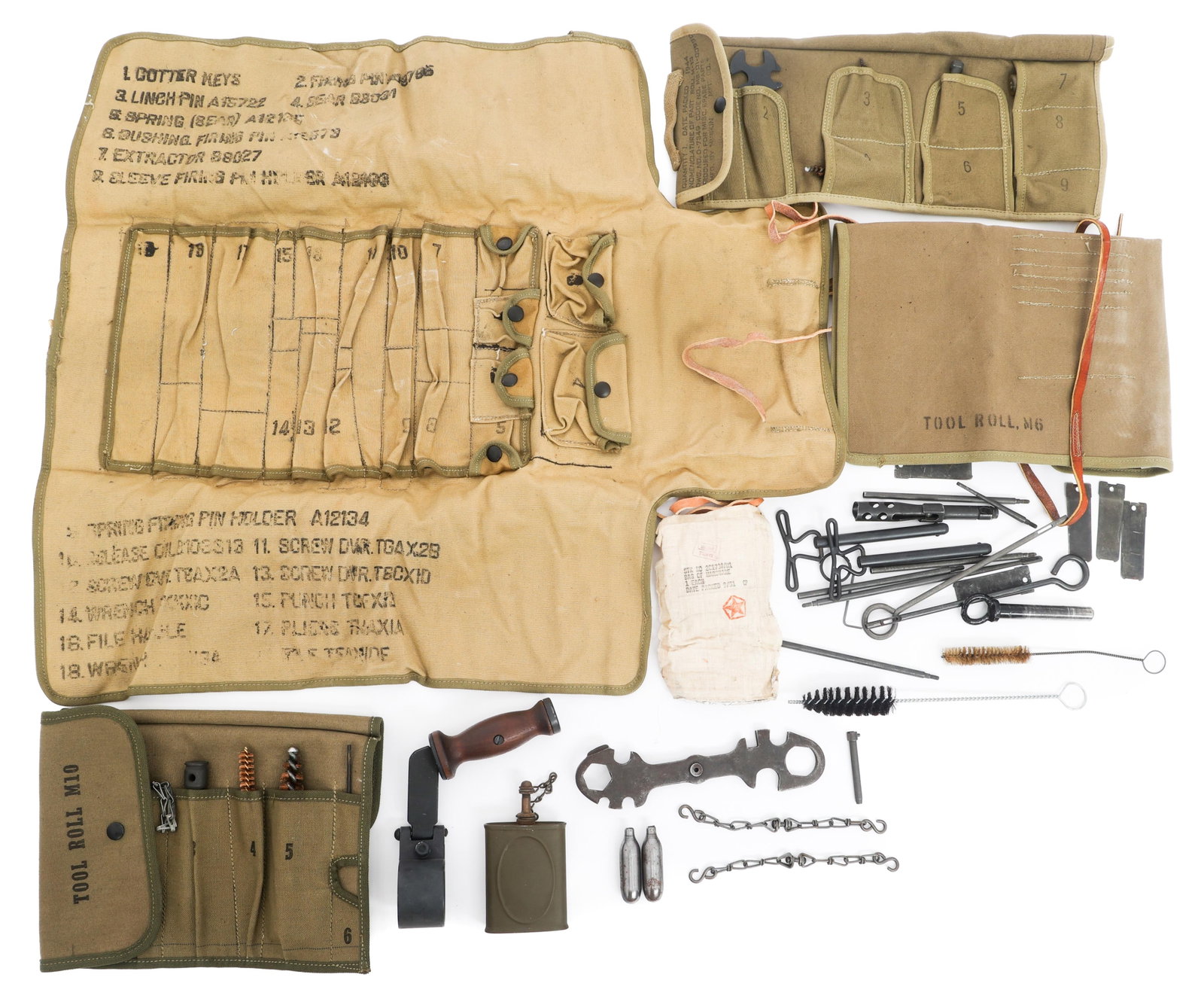 WWII - KOREA US MG & HOWITZER GUNSMITH TOOL ROLLS: WWII - KOREA US MG & HOWITZER GUNSMITH TOOL ROLLS WWII to Korean War US Army Machine Gun and 75mm Howitzer Gunsmith Tool Rolls. (4) Tool set canvas carrying rolls. Includes M6, 75mm, M10 and M13 Rolls