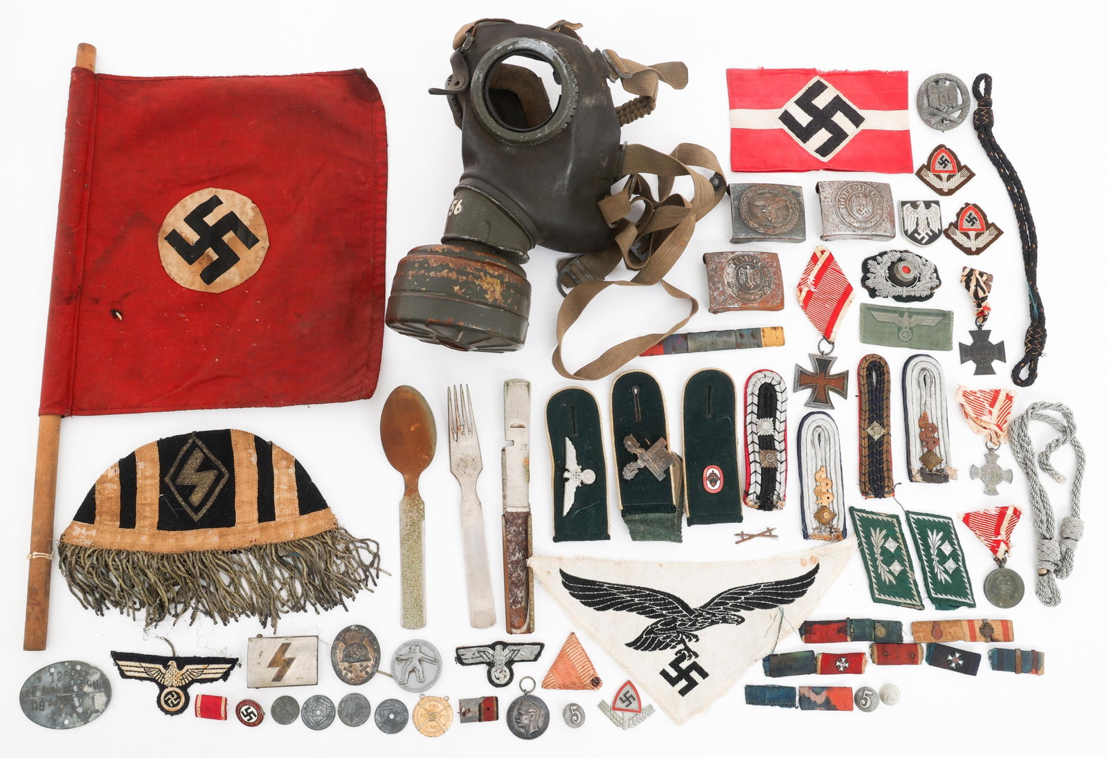 WWII - COLD WAR GERMAN INSIGNIA & GAS MASK BONANZA: WWII - COLD WAR GERMAN INSIGNIA & GAS MASK BONANZA WWII - Cold War NSDAP and West German Insignia and Gas Mask Bonanza. (1) West German Gm 54 Gas Mask with Filter. (1) WWII German NSDAP Flag.