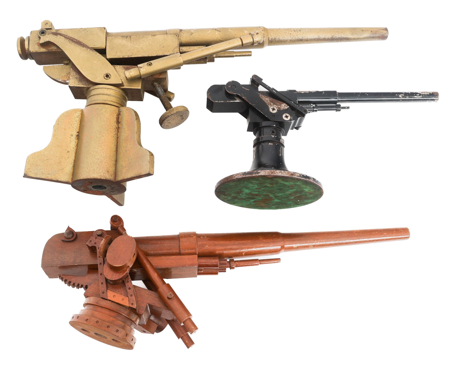 EARLY 20th C. NAVAL GUN MODELS: EARLY 20th C. NAVAL GUN MODELS Early 20th Century Wooden and Metal Naval Gun Models. (3) Guns on mounts. No visible marks. Size: 12" x 6" - 18" x 9" Weight: Varied