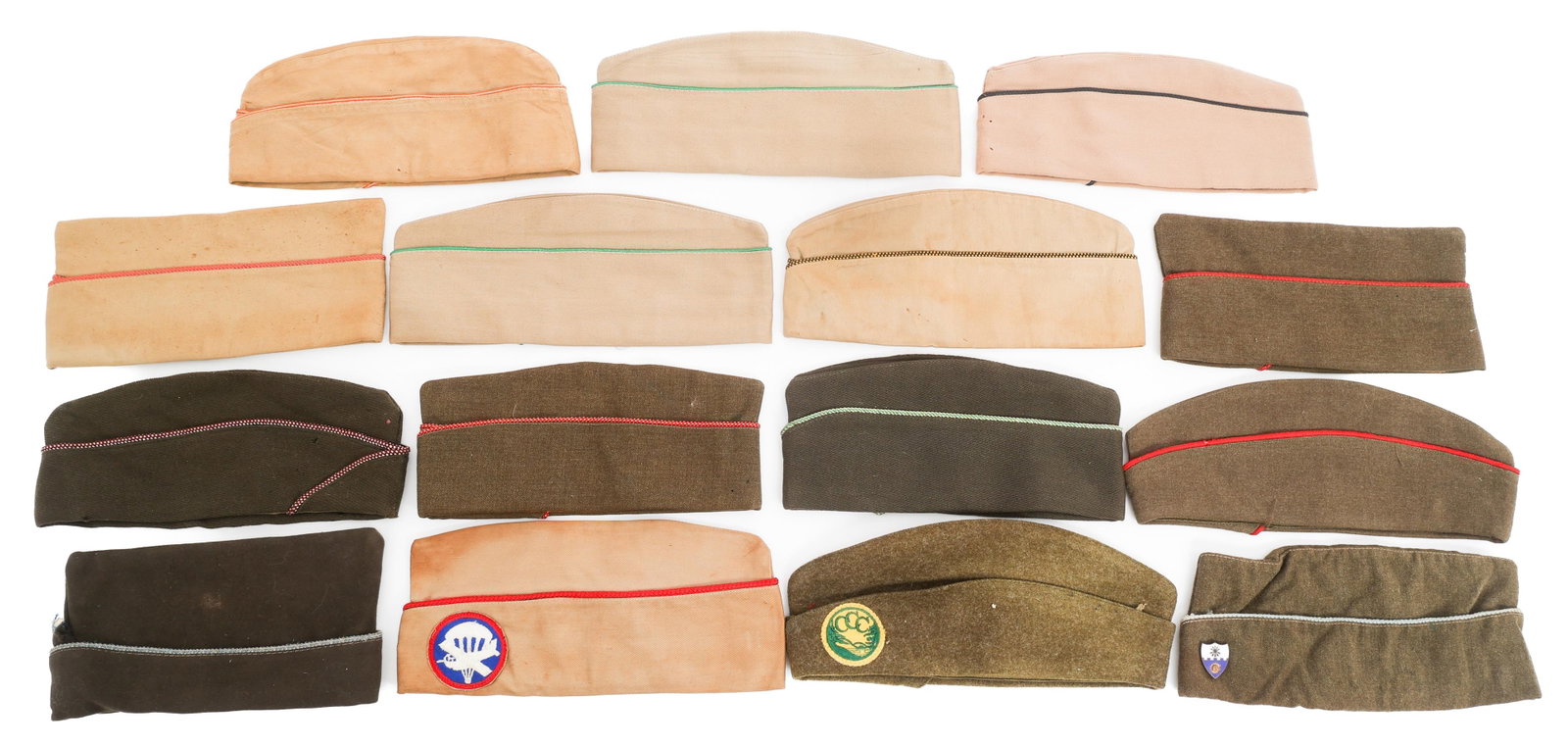 WWII US ARMY KHAKI COTTON & WOOL GARRISON CAPS: WWII US ARMY KHAKI COTTON & WOOL GARRISON CAPS (15) WWII US Army Garrison Caps. Khaki cotton and wool. Insignia includes Airborne, Civilian Conservation Corps and 22nd Infantry Division. Various sizes