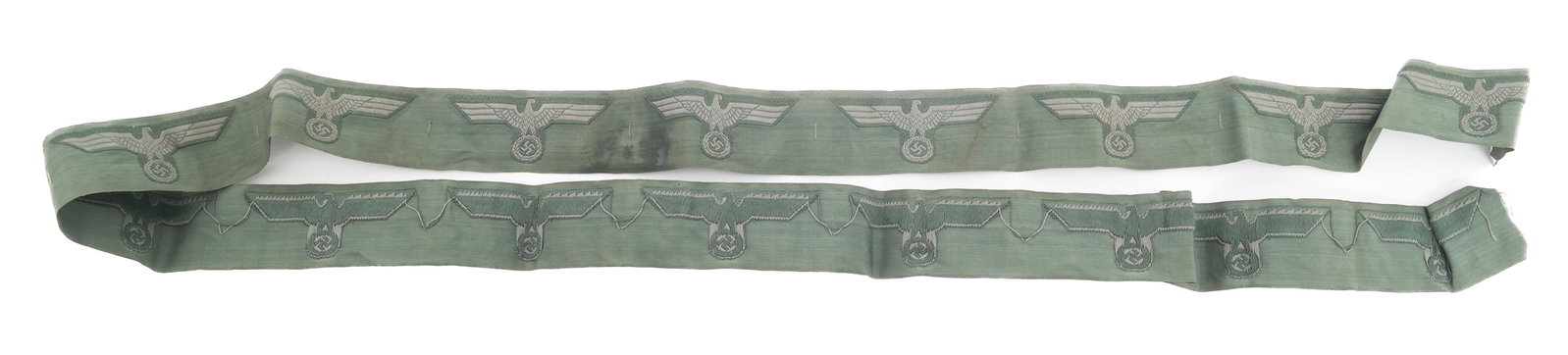 WWII GERMAN ARMY HEER BREAST EAGLE UNCUT RIBBON: WWII GERMAN ARMY HEER BREAST EAGLE UNCUT RIBBON WWII German Army Heer Breast Eagle Uncut Ribbon. Sand green uncut band of 16 Bevo cotton embroidered eagles. Size: 48"
