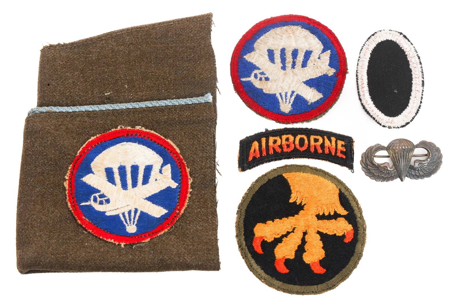 WWII US ARMY 17th AIRBORNE UNIT PATCH & WINGS: WWII US ARMY 17th AIRBORNE UNIT PATCH & WINGS WWII US Army 17th Airborne unit patch and sterling silver jump wings. (1) 17th Airborne patch with tab. (2) Airborne glider patches. One attached to blue 