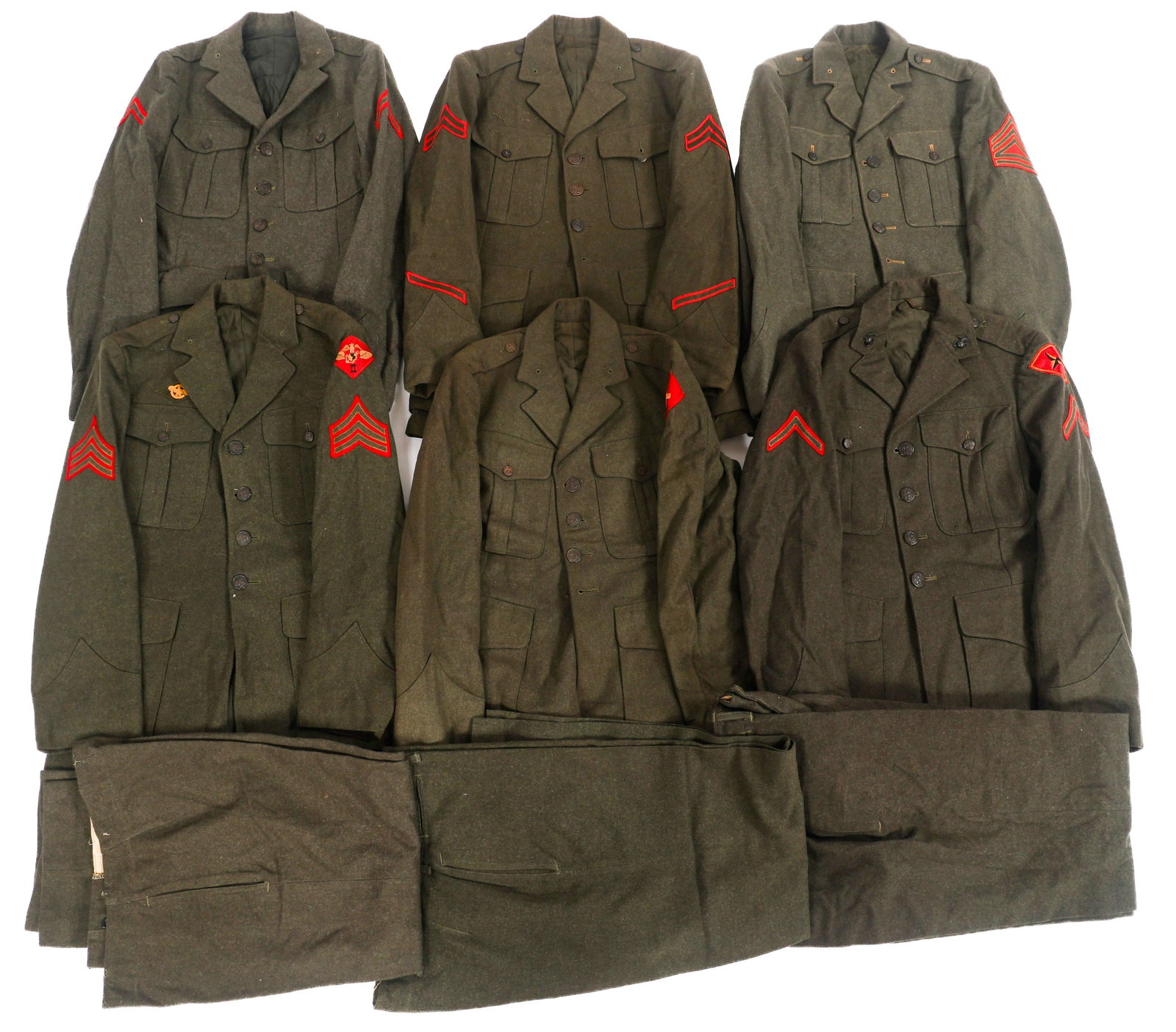 WWII USMC SERVICE ALPHA DRESS UNIFORMS: WWII USMC SERVICE ALPHA DRESS UNIFORMS WWII USMC Service Alpha Dress Uniforms. Forest green wool dress tunics, Vandegrift jacket, and trousers. Various shoulder unit patches and rank insignia. Size: S
