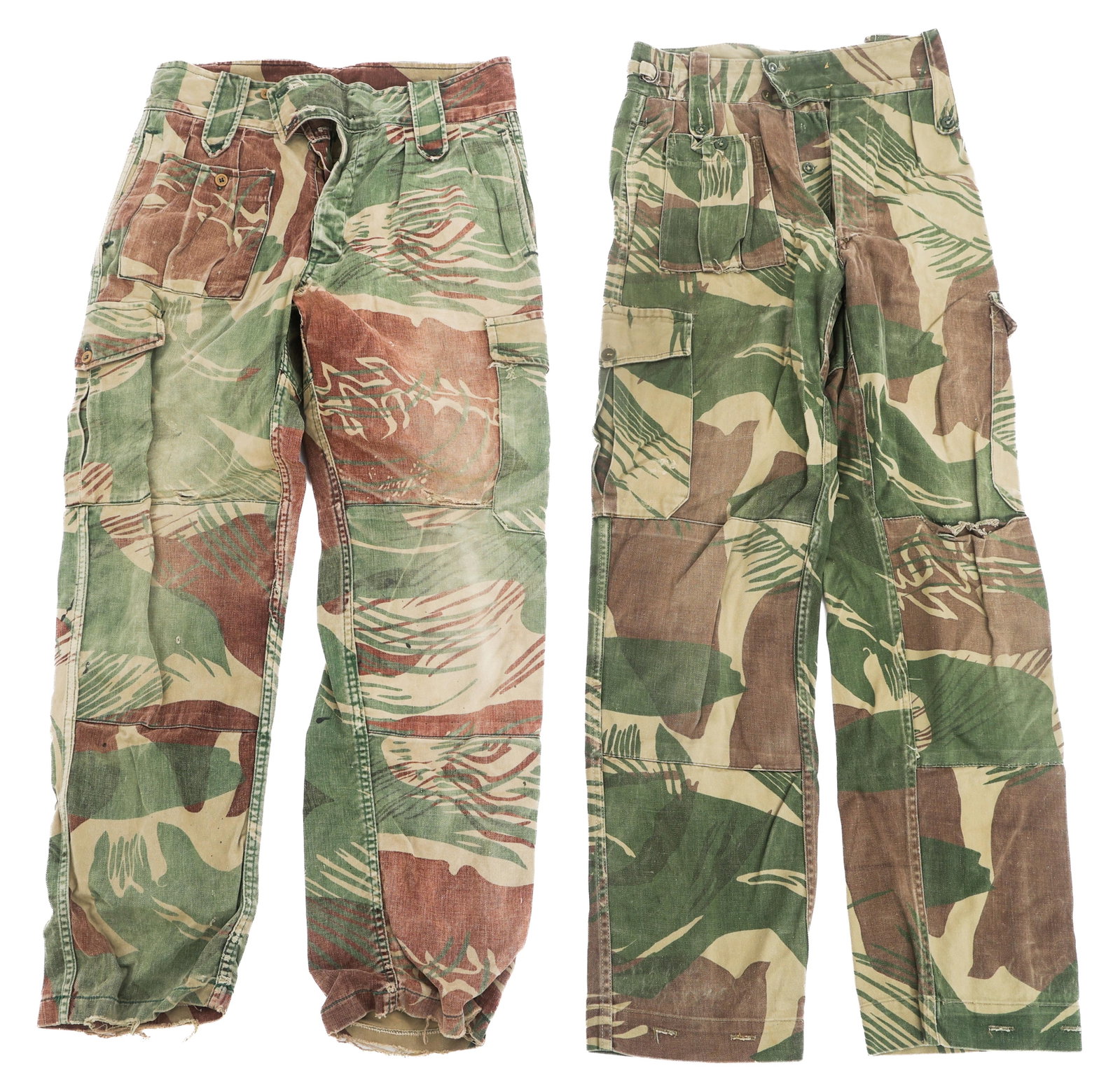 BUSH WAR RHODESIAN BRUSHSTROKE CAMO TROUSERS: BUSH WAR RHODESIAN BRUSHSTROKE CAMO TROUSERS Bush War Rhodesian Brushstroke Camouflage Trousers. (1) Trousers. Cloth with olive green buttons. Reinforced seat and knees. No visible maker marks. (1)