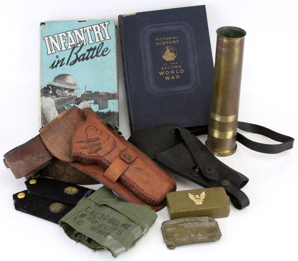 MIXED LOT OF MILITARY ITEMS: MIXED LOT OF MILITARY ITEMS 40 X 365 brass shell trench art. Shaving kit. Bay State Colt M 1928A1 belt buckle. 30 Cal clip holder. Shoulder boards. 2 leather gun belts. Infantry in Battle. Pictorial H