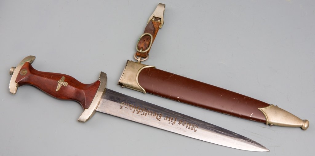 WWII GERMAN GEBRUDER HELLER SA DAGGER: WWII GERMAN GEBRUDER HELLER SA DAGGER 8.75 inch blade with GEBR.HELLER inscribed in large print on reverse and Alles fur Deutschland on front. 4 inch leather hanger. Very good condition with minimal w