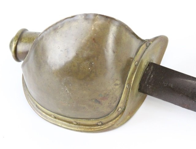 CIVIL WAR AMES 1860 NAVAL CUTLASS: CIVIL WAR AMES 1860 NAVAL CUTLASS 25.75 inch curved fullered blade with anchor over P above 1861 stamped in one side and Ames stamp in reverse. Dark patina to blade. Good condition with 0.5 inch damag