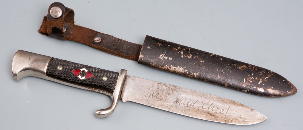 HITLER YOUTH KNIFE: HITLER YOUTH KNIFE 5 inch blade with Backhaus trade mark. 9.5 inches total. 6 inch metal sheath with5 inch leather hanger. Fair condition. Est. 100 - 150