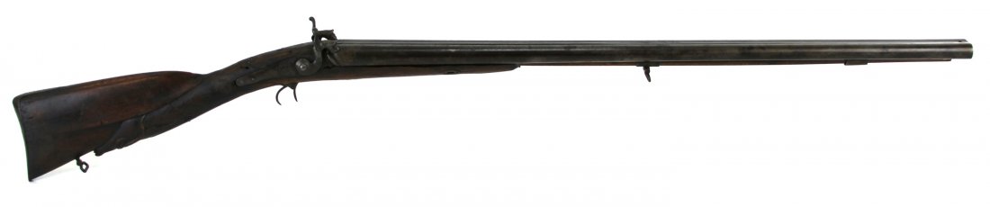 19TH CENTURY PERCUSSION SXS SHOTGUN RELIC: 19TH CENTURY PERCUSSION SXS SHOTGUN RELIC 19th Century percussion muzzle loading shotgun. 32 inch barrels, with 12 gauge bores. No makers or proof marks. Lower butt stock carved in form of elk's head.