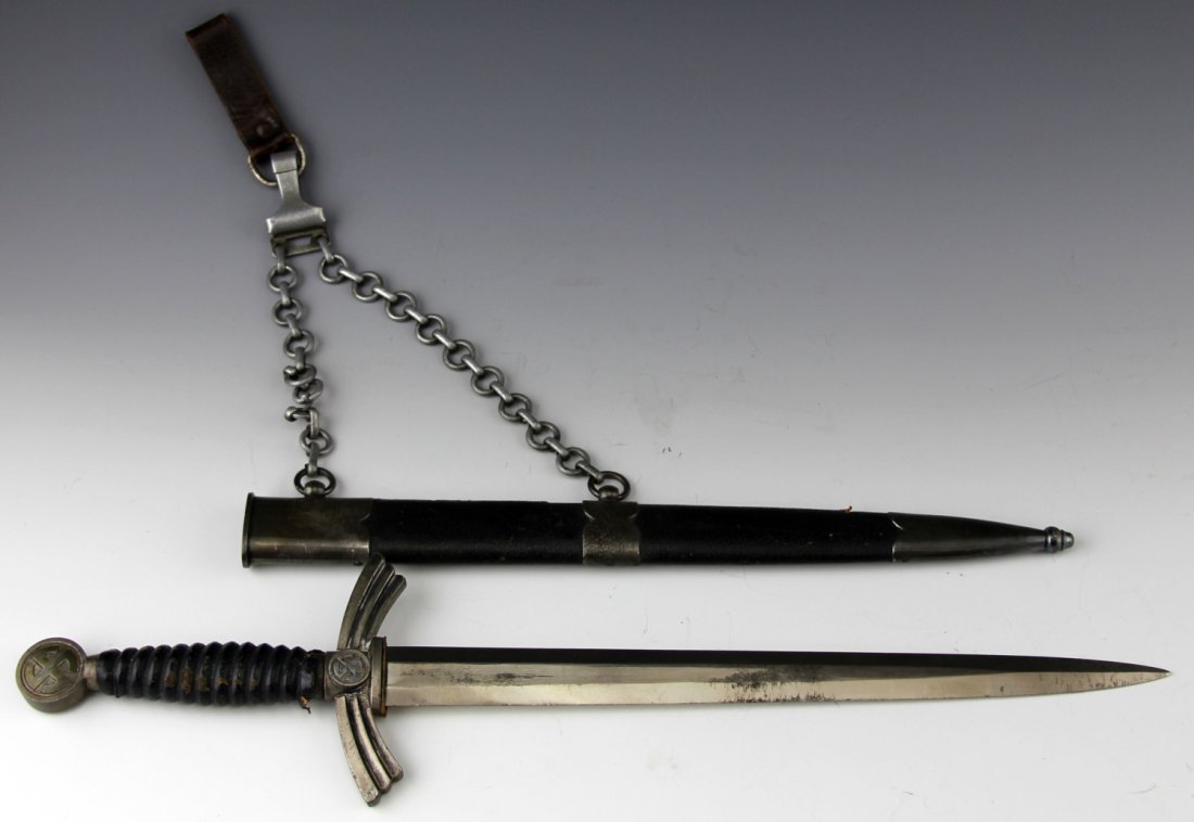 WWII GERMAN 1st MODEL LUFTWAFFE DAGGER BY WMW: WWII GERMAN 1st MODEL LUFTWAFFE DAGGER BY WMW Aluminum chain by Gesch with slight damage to one link, leather hanger attached. Type: Dagger Country: Germany Blade Length: 12" Overall Length: 17.75"