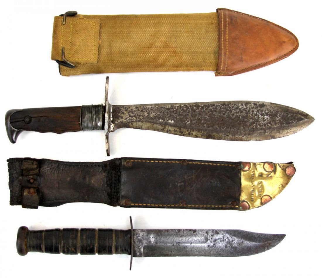TWO US KNIVES MODEL 1917 BOLO & USN MARK 2: TWO US KNIVES MODEL 1917 BOLO & USN MARK 2 Two US combat knives. US Model 1917 bolo knife, with Brauer Bros scabbard dated 1917, and a USN Mark 2 fighting knife by Ka Bar, with trench art plate at tip