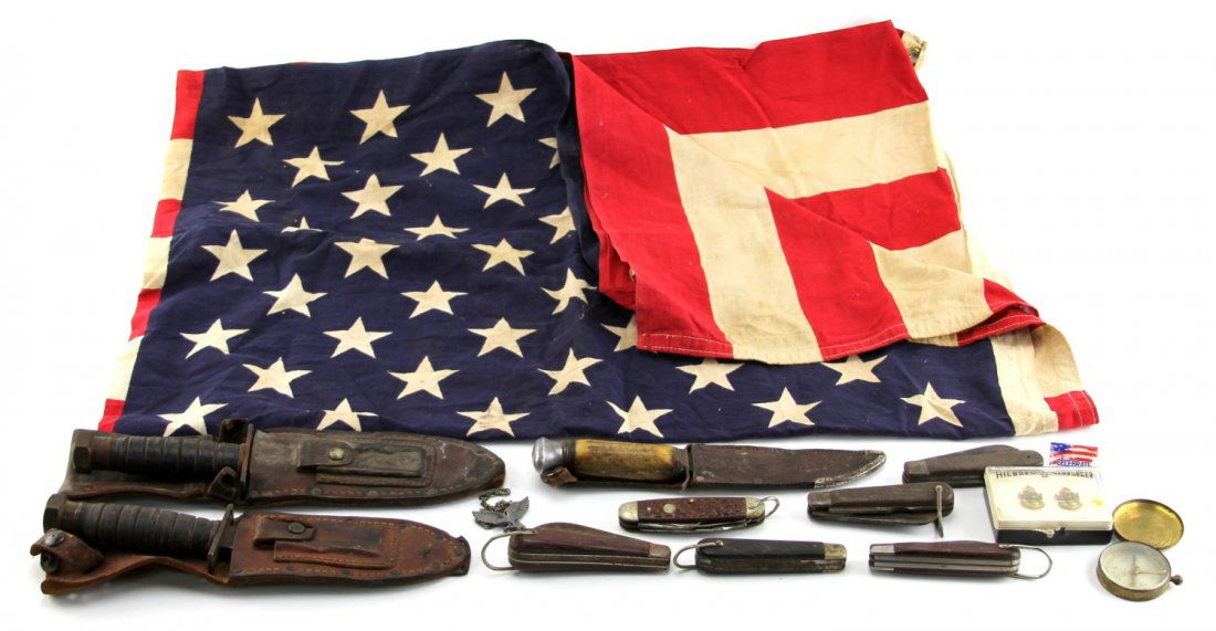 MIXED LOT 9 KNIVES FLAG & OTHER ITEMS: MIXED LOT 9 KNIVES FLAG & OTHER ITEMS Mixed lot of knives and other items, including two Camillus pilots knives, stag handled hunting knife, six folding knives, vintage US flag, and other small items.
