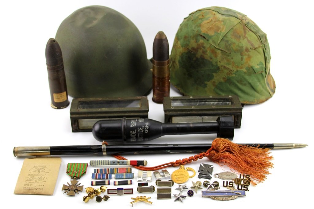 LARGE LOT OF MIXED MILITARIA: LARGE LOT OF MIXED MILITARIA Tank periscopes, M1 helmets, Korea swagger stick, M11A4 practice grenade, ribbons, medal, pins, and more. Era / Conflict: WWII Country: US