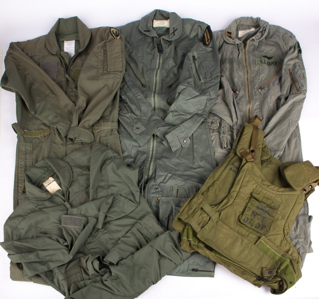 VIETNAM WAR US AIRCREW UNIFORM LOT: VIETNAM WAR US AIRCREW UNIFORM LOT Two 2 piece Nomex flight suits, two 1 piece Nomex flight suits, chicken plate body armor vest without plates Era / Conflict: Vietnam Country: US Provenance: From the