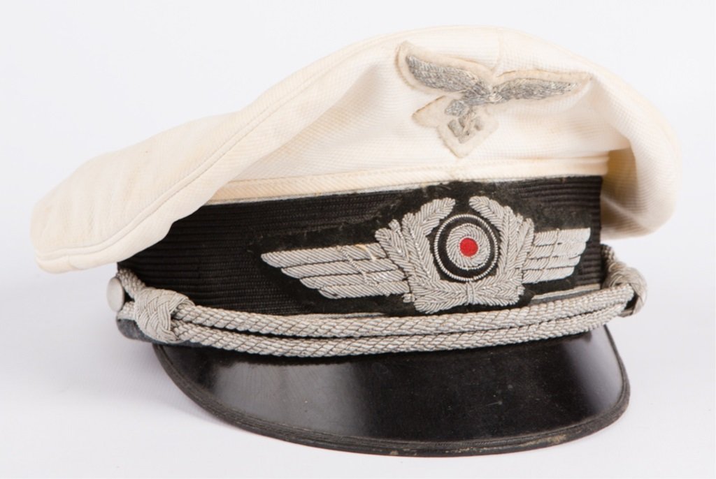 WWII GERMAN WHITE LUFTWAFFE OFFICER VISOR CAP: WWII GERMAN WHITE LUFTWAFFE OFFICER VISOR CAP Era / Conflict: WWII Country: Germany Provenance: From the collection of Robert D. Mitchell, who served in the U.S. Army from September 1976 thru February