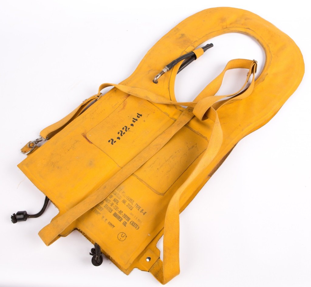 WWII US B-4 MAE WEST LIFE PRESERVER: WWII US B-4 MAE WEST LIFE PRESERVER Era / Conflict: WWII Country: US Provenance: From the collection of Robert D. Mitchell, who served in the U.S. Army from September 1976 thru February 2001 as an Cob