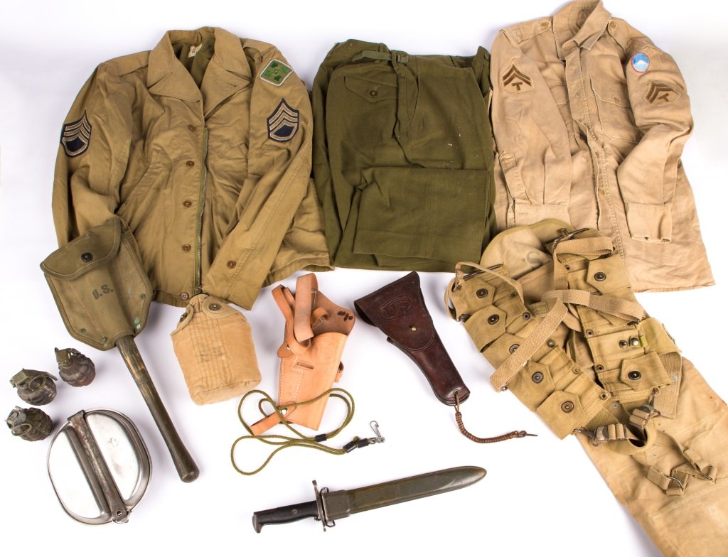 LARGE WWII US UNIFORM AND GEAR LOT: LARGE WWII US UNIFORM AND GEAR LOT M43 field jacket, shirt, and trousers. Mills web belt with M1 bandoleers, suspenders, mess kit, and pack. Shovel and canteen. M1 bayonet with scabbard. 2 holsters. 3