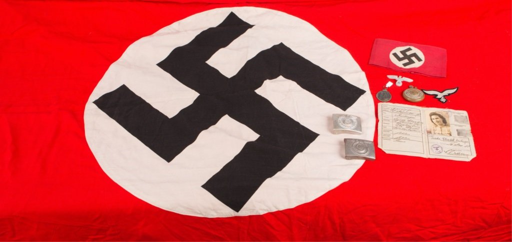 LOT OF WWII GERMAN ITEMS: LOT OF WWII GERMAN ITEMS NSDAP flag and armband, trench lighter, belt buckles, and more Era / Conflict: WWII Country: Germany