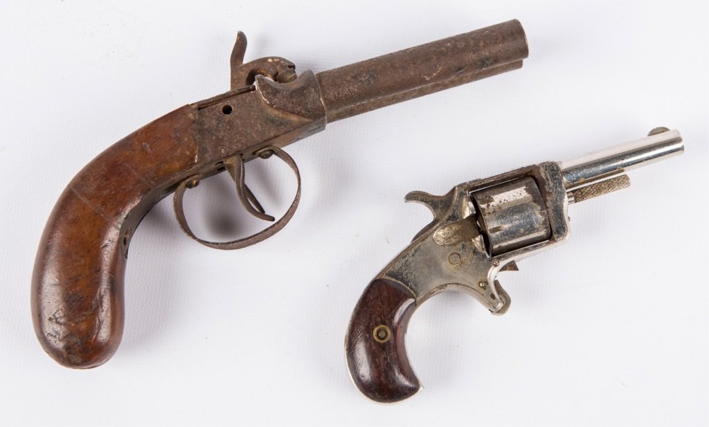LOT OF 2 ANTIQUE PISTOLS: LOT OF 2 ANTIQUE PISTOLS Prairie King 7 shot revolver. German double barrel percussion pistol. Provenance: Collection of lifelong relic hunter, Wilbur C. Bedall. Born in 1929 and raised until about th