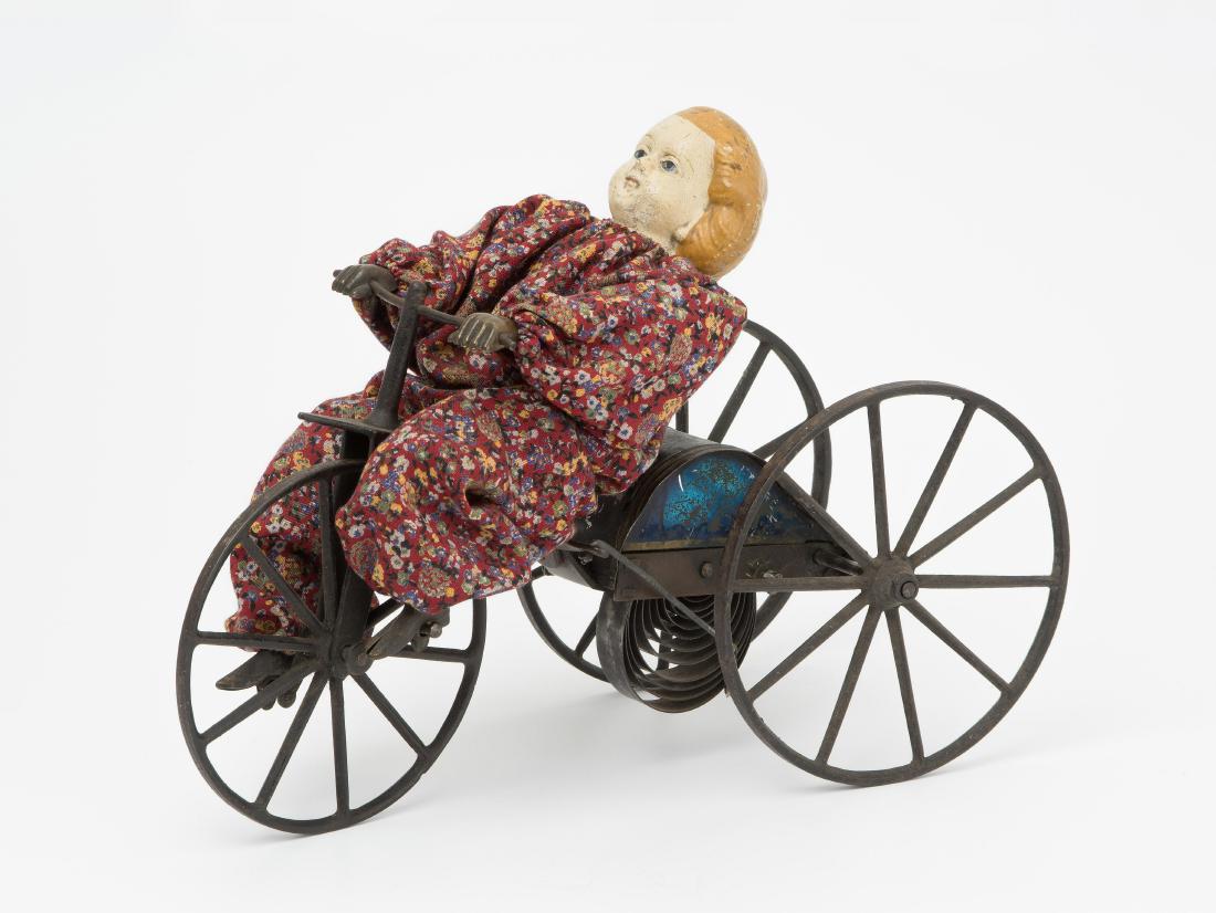 Puppenautomat "Mädchen auf Dreirad" Wohl USA, um 1880. (1 of 1)