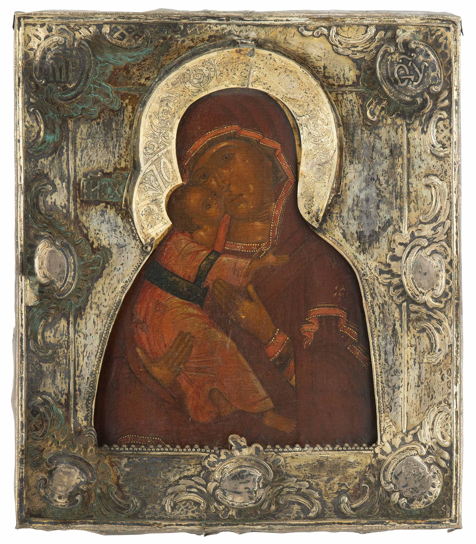 Gottesmutter von Wladimir mit vergoldeter Silberbasma: Russisch, Ende 18.Jh. (1) Ikone. Tempera über Kreidegrund auf Holz. Im vertieften Mittelfeld Darstellung der Gottesmutter, das Kind - Wange an Wange - im rechten Arm haltend. (2). Basma. Silber vergo