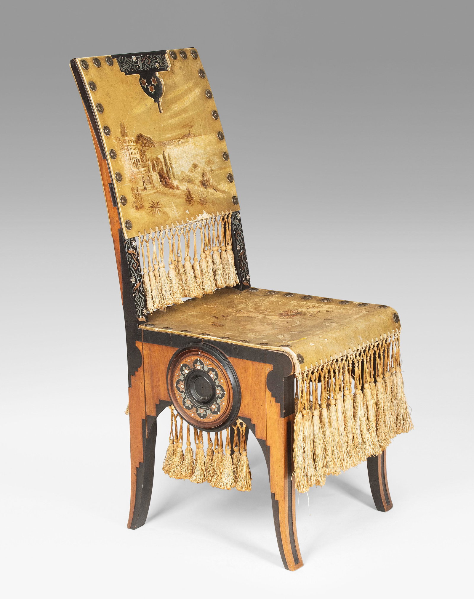 Carlo Bugatti, i.d.Art: Stuhl. Um 1900. Teilweise aus Originalteilen bestehend. Ebonisiertes Nussbaumholz, Zierornamentik aus Zinn- und Perlmuttintarsien, Metallknöpfe, Kordeln und bemaltes Pergament. 42x53x94,5; Sitzhöhe 