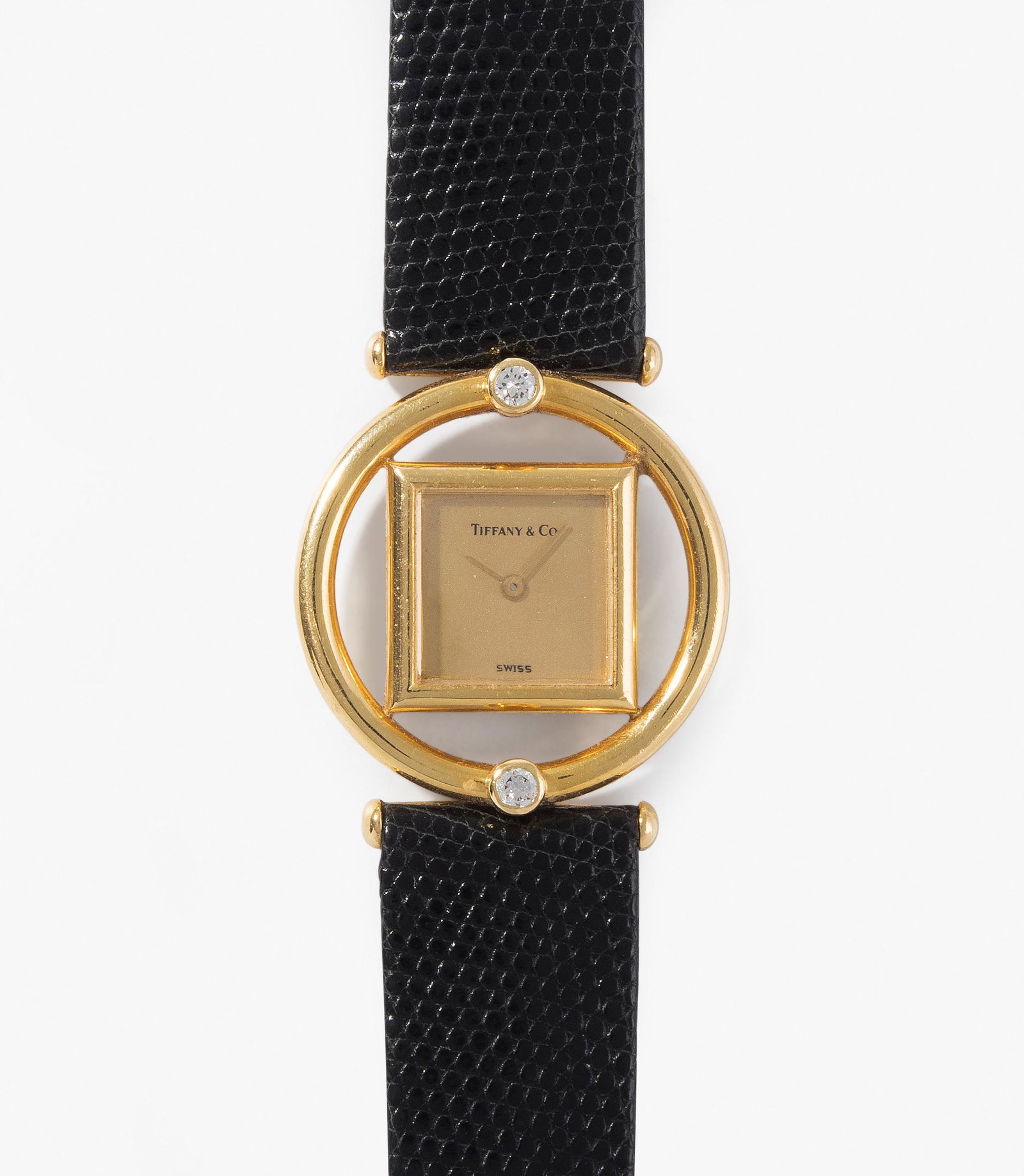 Tiffany Paloma Picasso, 1984: 750 Gelbgold-GehÃ¤use, 30 mm, zwei Brillanten ca. 0.20 ct. Quarzwerk. Vergoldetes Zifferblatt, Stabzeiger. Lederband mit Gold-Dornschliesse. GehÃ¤useboden und Zifferblatt signiert. FunktionstÃ¼c