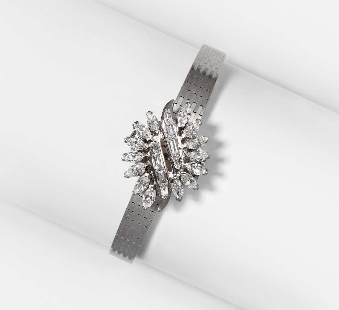 Movado Diamant-Damenarmbanduhr 1960er Jahre.: Movado Diamant-Damenarmbanduhr 1960er Jahre. Eszeha-Gehäuse Nr. 42465. Handaufzug, Cal. 6. 750 Weissgold. Kleines, rundes Gehäuse, silberfarbenes Zifferblatt mit applizierten Indizes und Zeiger. Ele