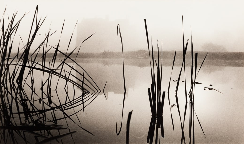 Michael Kenna (Am. b. 1953), "Reflection, Broughton Castle" Oxfordshire, England, 1977 (Printed: Michael Kenna (Am. b. 1953) "Reflection, Broughton Castle" Oxfordshire, England, 1977 (Printed 1980) Gelatin silver print, matted Signed in pencil on mount l.r., dated in pencil on mount l.l