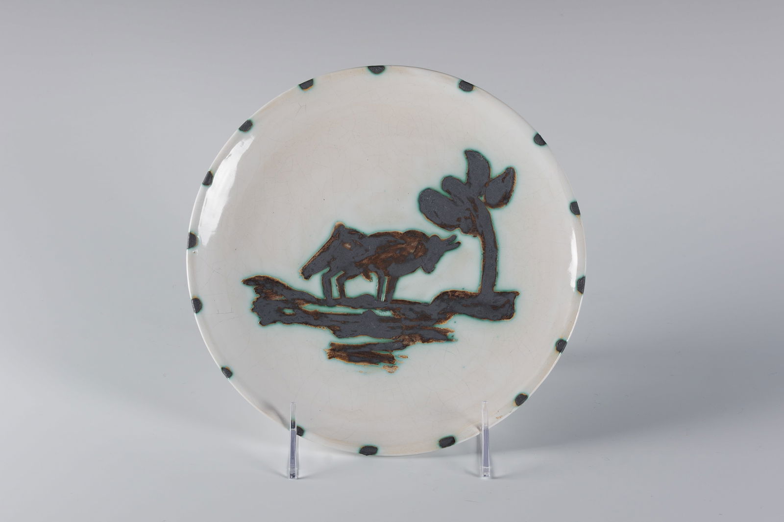 Pablo Picasso (Sp. 1881-1973), White earthenware ceramic with oxidized paraffin decoration (1 of 3)