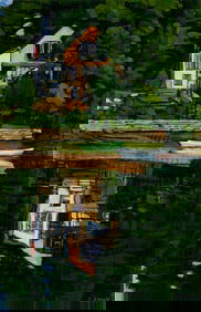 Sarah Knock (Am. b. 1947), Cottage with Boat, Oil on paper, framed under glass