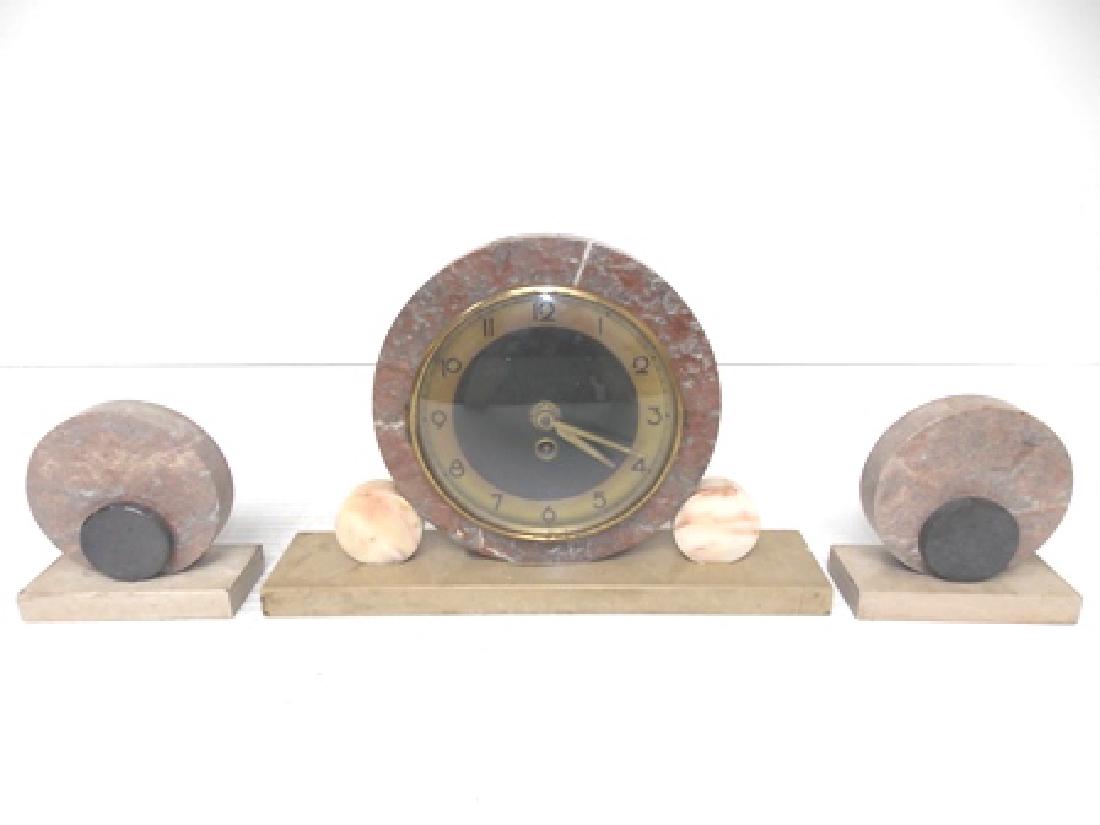 VINTAGE ANTIQUE ART DECO MARBLE CLOCK SET: VINTAGE ANTIQUE ART DECO MARBLE CLOCK SET. THE CLOCK MEASURES 8 3/4" TALL BY 13 1/2" LONG BY 2 3/4" WIDE. THE LITTLE BOOKENDS MEASURE 5" BY 5" BY 2 1/4". NOT SURE WHO THE MAKER IS. DOES HAVE FLAWS AND