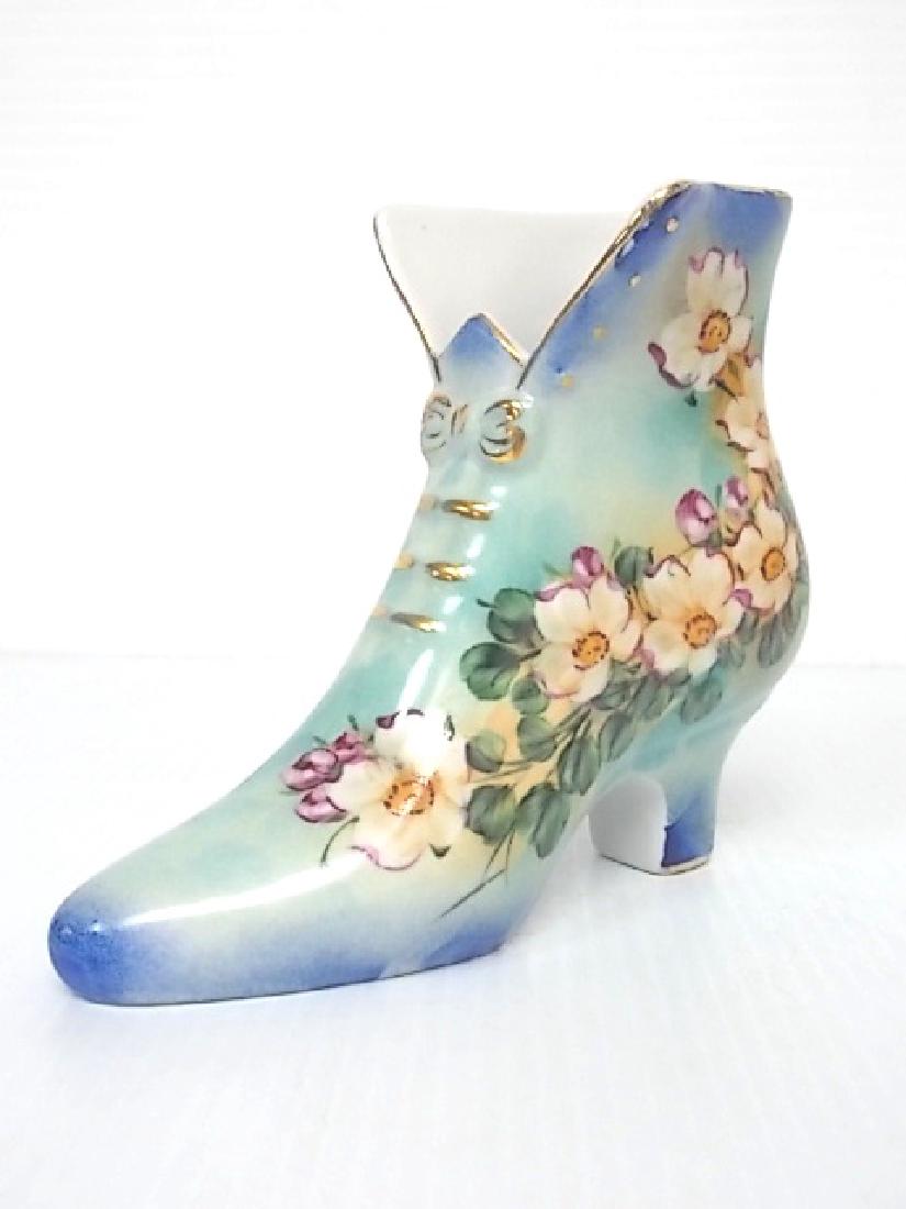 DECORATIVE PORCELAIN FLORAL LIMOGES BOOT FIGURE: FOR SALE IS THIS BEAUTIFUL DECORATIVE PORCELAIN FLORAL VICTORIAN BOOT FIGURE. PIECE MEASURES ABOUT 6 1/4" TALL BY 7 3/4" LONG BY 3 1/2" WIDE. CONDITION LOOKS GREAT NO CHIPS OR CRACKS. SHIPPING AND HAN