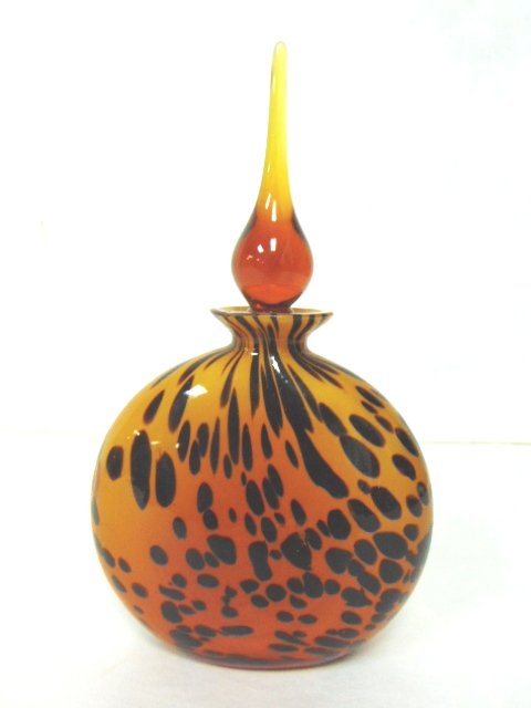 DECORATIVE LEOPARD GLASS PERFUME BOTTLE: A NICE DECORATIVE LEOPARD GLASS PERFUME BOTTLE THAT MEASURES 7 1/4" TALL BY 4 1/4" BY 1 3/4". SHIPPING AND HANDLING IS $14 WITHIN THE CONTINENTAL US. ALL OTHER STATES AND COUNTRIES PLEASE CONTACT FOR