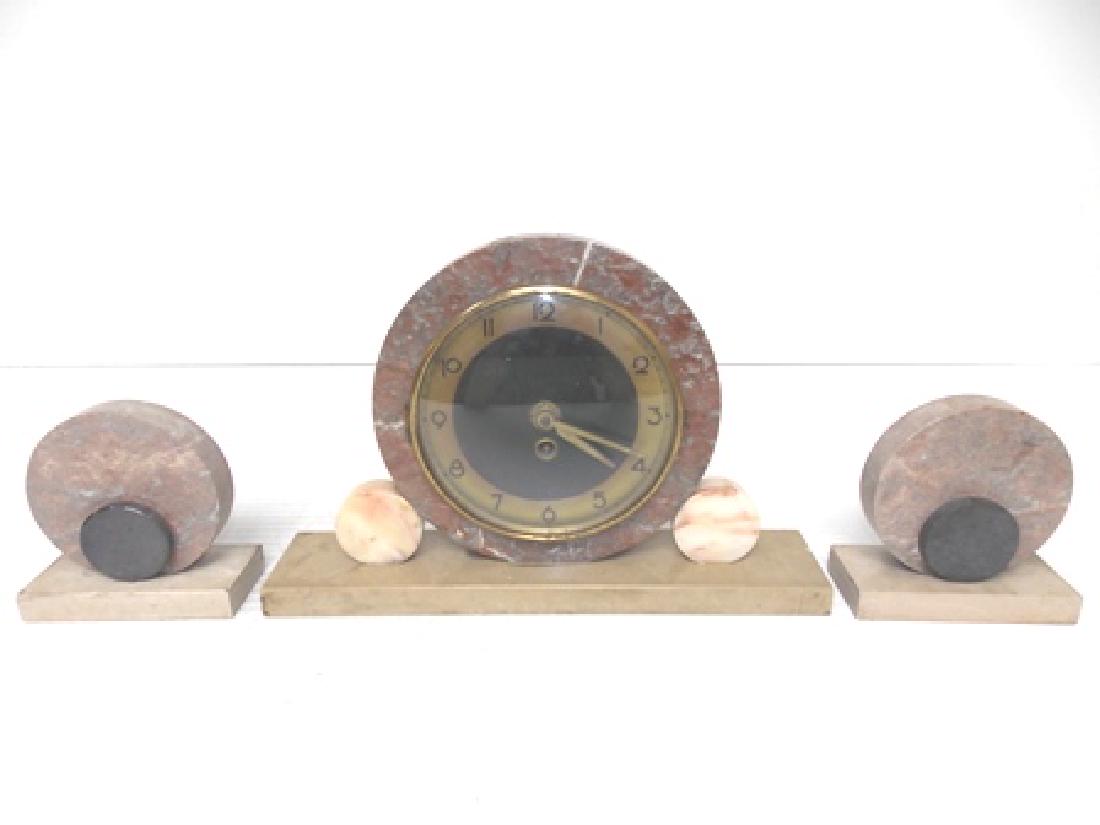 VINTAGE ANTIQUE ART DECO MARBLE CLOCK SET: VINTAGE ANTIQUE ART DECO MARBLE CLOCK SET. THE CLOCK MEASURES 8 3/4" TALL BY 13 1/2" LONG BY 2 3/4" WIDE. THE LITTLE BOOKENDS MEASURE 5" BY 5" BY 2 1/4". NOT SURE WHO THE MAKER IS. DOES HAVE FLAWS AND