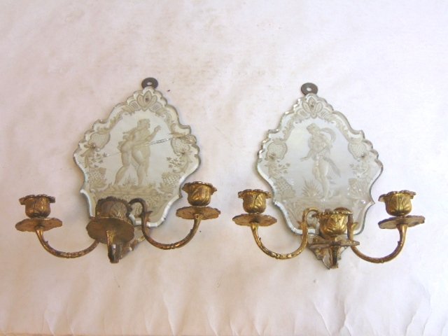 Pr Antique Venetian Nude Mirror Wall Sconces: A PAIR OF ANTIQUE VENETIAN STYLE WALL SCONCES WITH A NUDE MALE ON ONE AND A NUDE FEMALE ON THE OTHER. LOOKS LIKE IT MAY BE AN ADAM & EVE DEPICTION. EACH SCONCE MEASURES 13" LONG BY 10 1/2" WIDE. AS YO