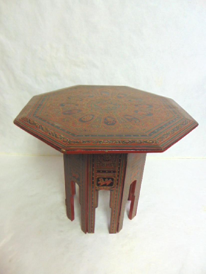 VINTAGE ANTIQUE HAND PAINTED CHINESE TIBETAN TABLE: A BEAUTIFUL DECORATIVE HAND PAINTED CHINESE LACQUERED TIBETAN OCTAGON SHAPED SIDE TABLE. THE TABLE MEASURES 18" TALL BY 20 " WIDE. CONDITION IS GOOD FOR ITS AGE BUT AS YOU CAN SEE IN THE PICS IT DOES