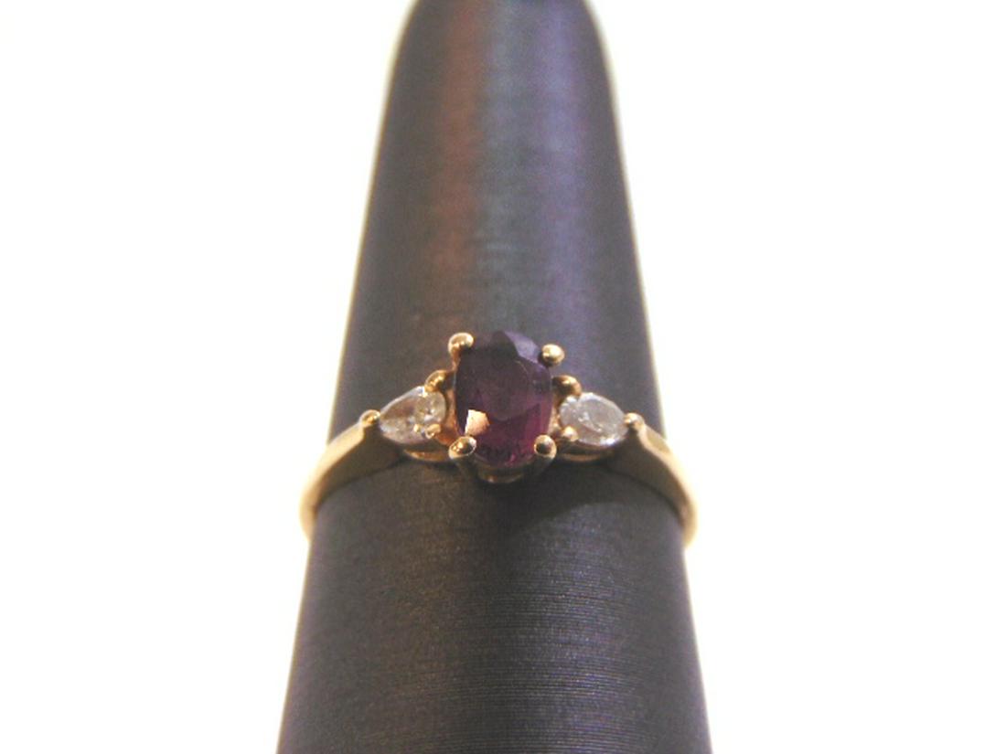 Womens Vintage Estate 14k Gold Garnet & Diamond Ring: THIS ITEM IS A WOMENS VINTAGE ESTATE 14K GOLD GARNET & DIAMOND RING. RING IS MARKED ON THE INSIDE "CID 14KP". THE SIZE OF THE RING IS A 7.0. RING WEIGHS 2.0g AND THERE ARE ABOUT .04cts OF DIAMONDS. NO