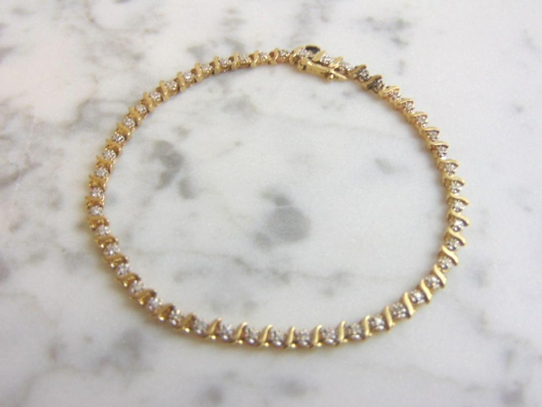 Womens Vintage Estate 14K Gold Diamond Tennis Bracelet: A LOVELY VINTAGE ESTATE 14K YELLOW GOLD DIAMOND TENNIS BRACELET. THE BRACELET WEIGHS 6.2g, AND MEASURES ABOUT 7 1/2" LONG BY 1/8" WIDE. THERE ARE ABOUT .48cts OF DIAMONDS IN THE BRACELET. WOULD MAKE A