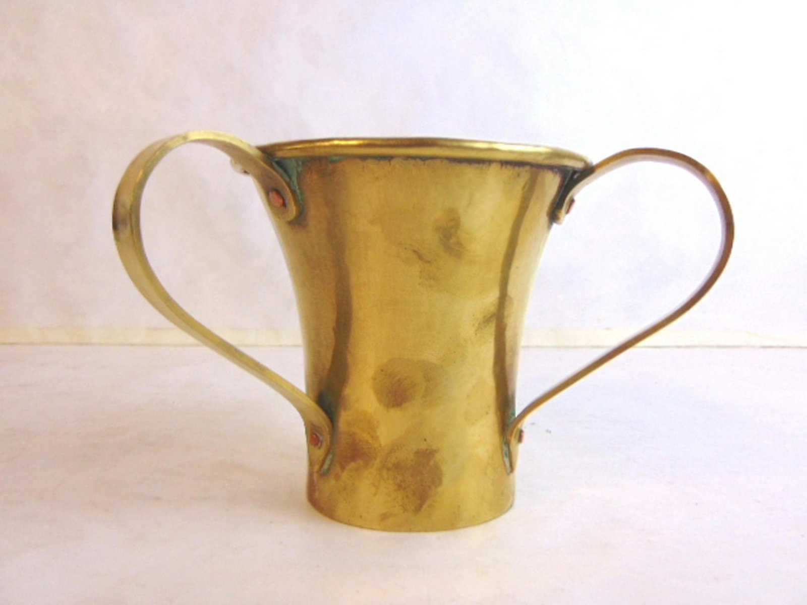 RARE ANTIQUE IMPERIAL RUSSIAN JUDAICA BRASS CUP: An antique hand hammered Russian brass laver cup that measures 4 1/2" tall by 7" wide. Condition looks very good for its age. Has a nice makers mark on the bottom. Any questions please do not hesitate