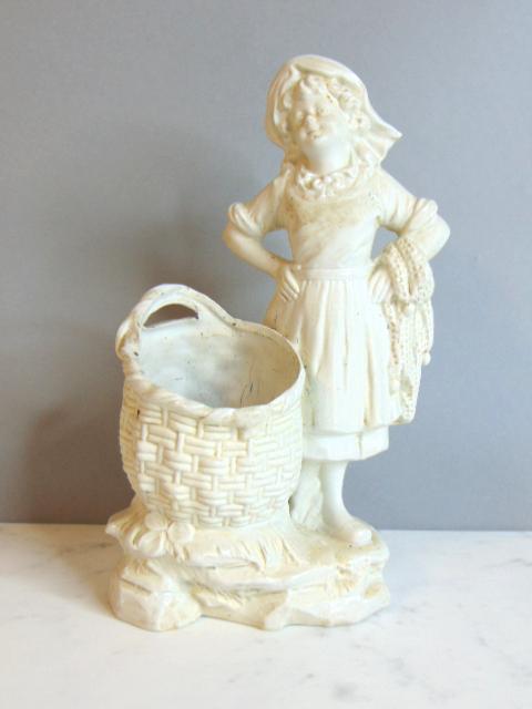 DECORATIVE PORCELAIN BISQUE PEN HOLDER FIGURE: A porcelain bisque pen holder figure that stands 8 1/4" tall by 5" long. Condition is good to fair. As you can see it does have a pen marks on the inside of the holder. I dont see any chips or cracks.